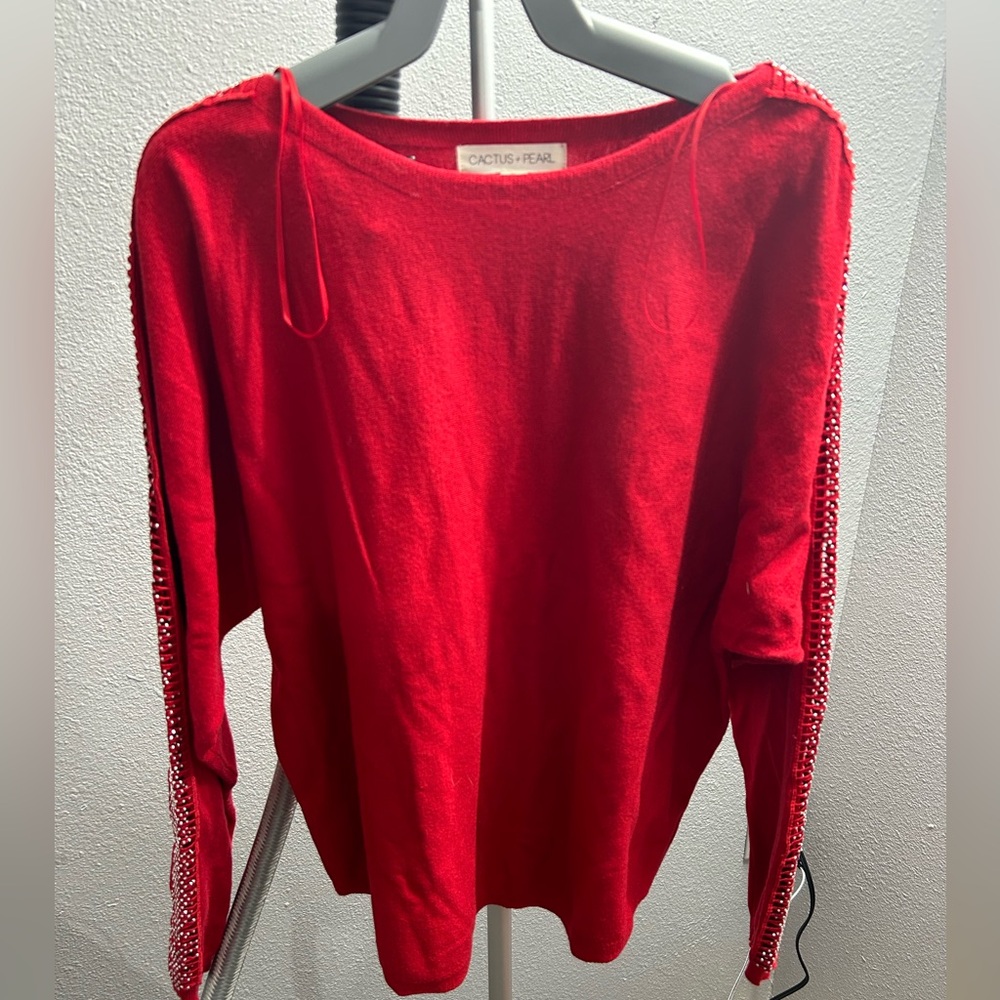 Bright red long sleeve sweater with cut out and sparkles down the sleeves. Sz S